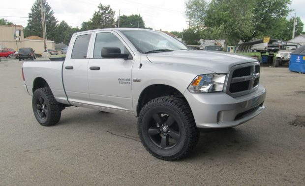 Silver Dodge Ram 1500 lifted