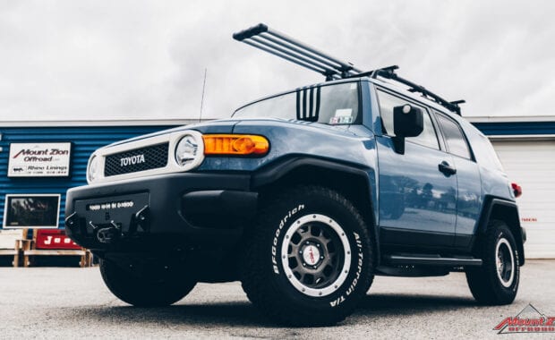 Blue FJ cruiser with winch and roof rack