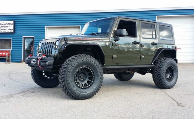 Lifted Green Jeep rubicon on Method Wheels and Toyo tires