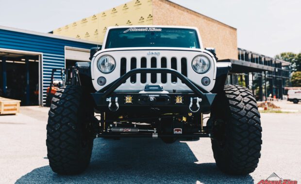 white 2015 Jeep wrangler with offroad bumper with winch and rigid fog lights
