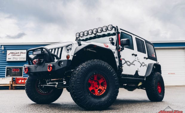 White 15 Jeep Wrangler with KC offroad lights and Red wheels