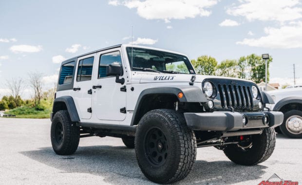 White 2015 Jeep Wrangler on Pro Comp Wheel with Pro Comp Tire front passenger side grille view