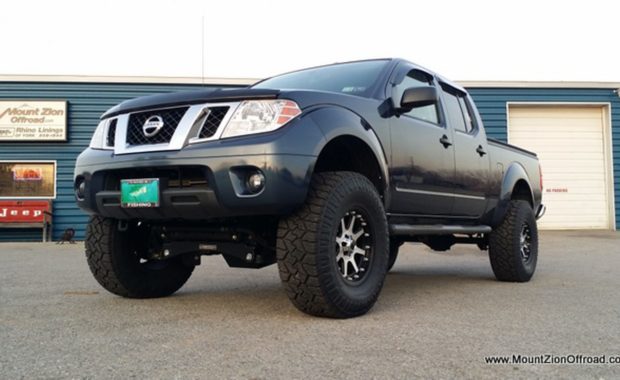 Blue Lifted Nissan Titan on XD wheels and tires