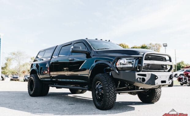 Black 16 Ram 3500 duall with front offroad bumper and fuel wheels front passenger side grille view