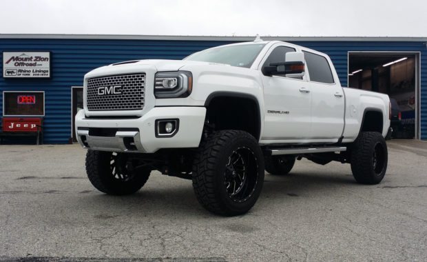 White 2017 GMC Denali lifted with Fuel Wheels front driver side at mount zion offroad