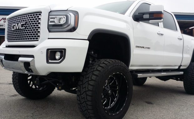 White 2017 GMC Denali lifted with Fuel Wheels front driver side wheel well at mount zion offroad