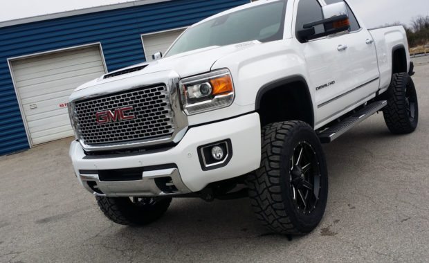 White GMC denali HD lifted with Fuel wheels