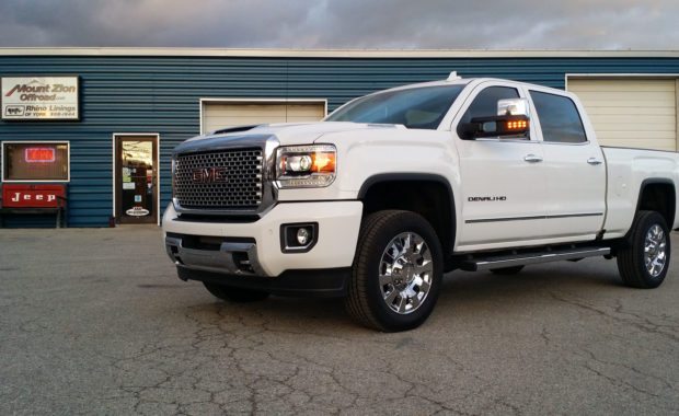 White GMC Denali HD before being lifted with Fuel Wheels