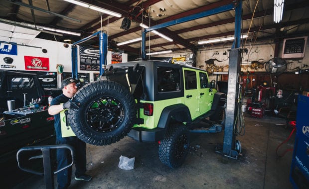 Green 2017 Jeep Wrangler lifted with offroad wheels