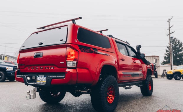 17 Tacoma fox 2.5 coilover suspension on 17x9 6x5.5 106.1 Candy Red Covert Fuel MHT -12mm and Nitto Ridge Grappler 33x12.50R17 tires rear passenger side view