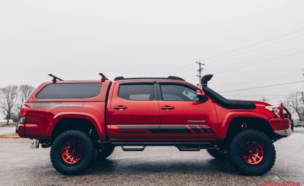 17 Tacoma fox 2.5 coilover suspension on 17x9 6x5.5 106.1 Candy Red Covert Fuel MHT -12mm and Nitto Ridge Grappler 33x12.50R17 tires with snorkel passenger side view