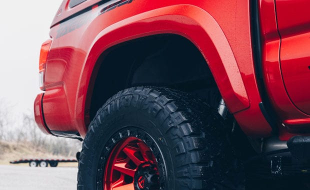 17 Tacoma fox 2.5 coilover suspension on 17x9 6x5.5 106.1 Candy Red Covert Fuel MHT -12mm and Nitto Ridge Grappler 33x12.50R17 tires rear tire view