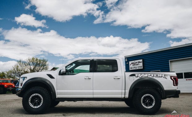 White 2018 Ford Raptor with 37x12.50R17 General Grabber X3 M/T driver side view