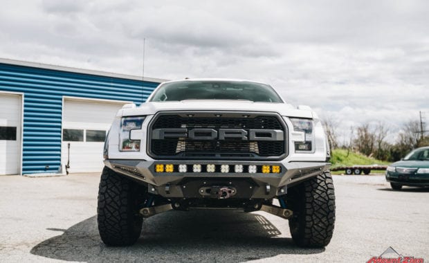 White 2018 Ford Raptor with 37x12.50R17 General Grabber X3 M/T with ADD offroad bumper front grille view