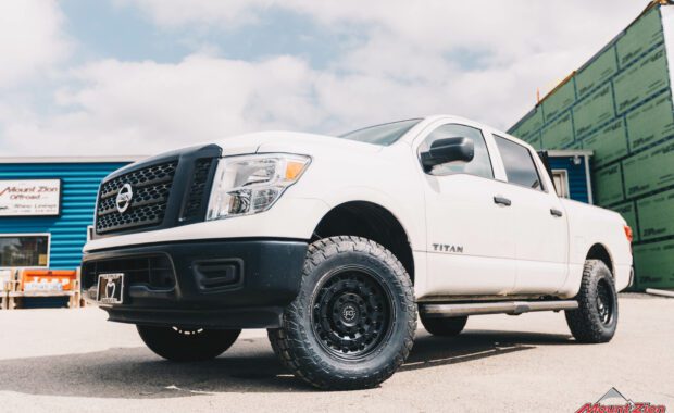 2018 Nissan Titan with Bilstein 6100 suspension on 18x9 Black Rhino Armory and LT275/70R18 Toyo Open Country front grille driver side view