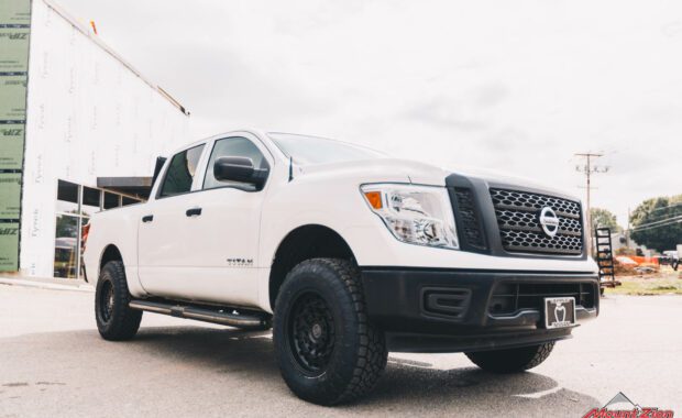 2018 Nissan Titan with Bilstein 6100 suspension on 18x9 Black Rhino Armory and LT275/70R18 Toyo Open Country passenger side grille view