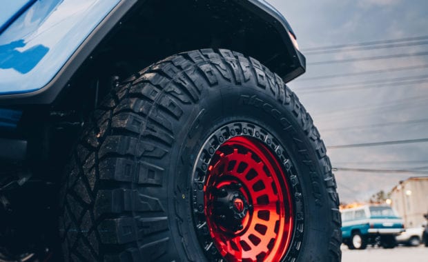 Red Fuel wheel on blue jeep