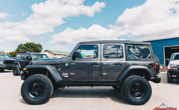 2019 Jeep Wrangler with AEV N0724100AA 2.5in suspension on AEV 20402034AA Pintler Wheel In Matte Black and 35X12.50R17 Falken Wildpeak AT3W driver side view