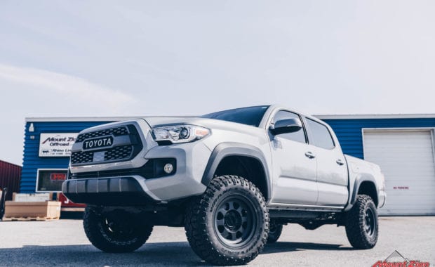 2019 Tacoma TRD Pro with Bilstein 5100 leveling kit on Method 701 16x8.5 wheels and Goodyear LT265/75R16 Tires front driver side grille view