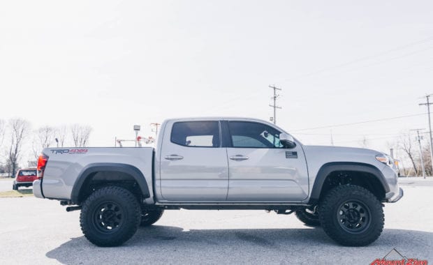 2019 Tacoma TRD Pro with Bilstein 5100 leveling kit on Method 701 16x8.5 wheels and Goodyear LT265/75R16 Tires passenger side view