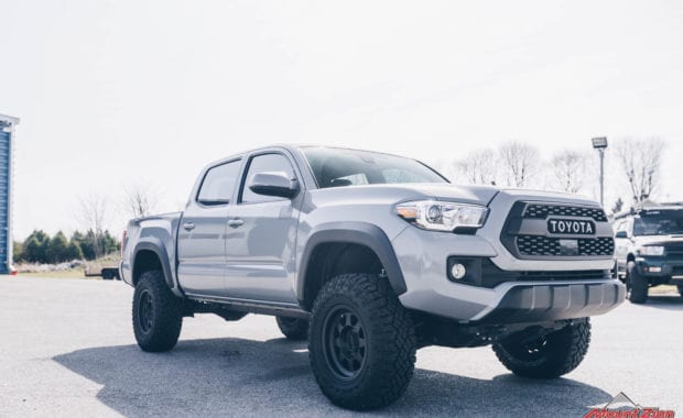 2019 Tacoma TRD Pro with Bilstein 5100 leveling kit on Method 701 16x8.5 wheels and Goodyear LT265/75R16 Tires front passenger side grille view