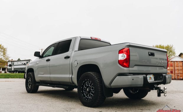 Grey 2019 Tundra on KMC XD 820 18x9 +18mm Wheel and LT305/65R18/10 124/121R FAL WILDPEAK A/T3W RBL Tire rear driver side tailgate view