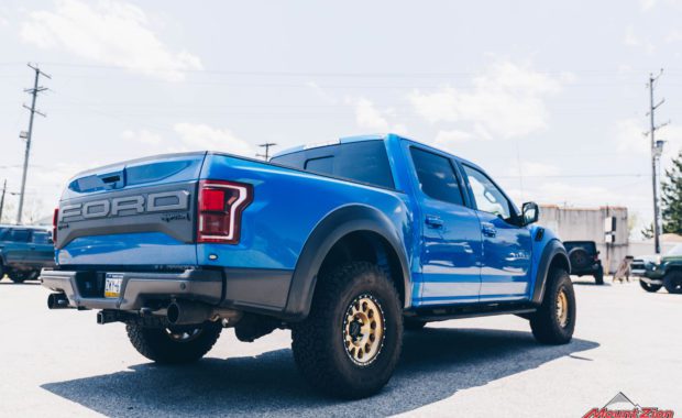 Blue 2020 Ford Raptor with Gold Method 315 17x8.5 +0 mm Wheels rear passenger side tailgate view