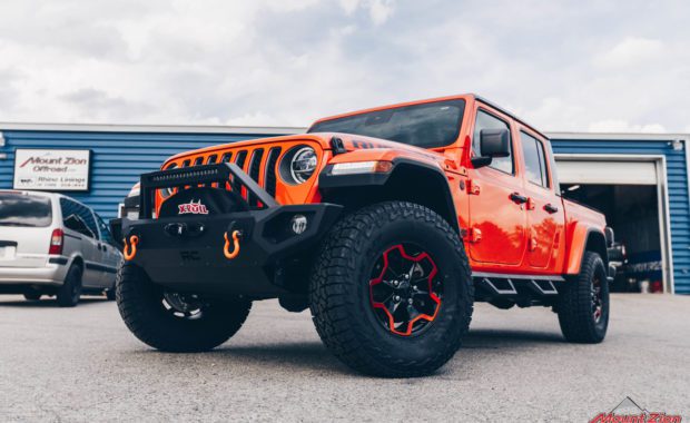 Orange Gladiator Rubicon RC 3/4 Coil Spacer on Falken AT3W 35x12.50R17 and Painted Wheels Clear Candy Orange front driver side grille view