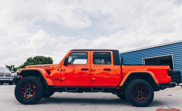 Orange Gladiator Rubicon RC 3/4 Coil Spacer on Falken AT3W 35x12.50R17 and Painted Wheels Clear Candy Orange driver side view