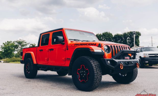 Orange Gladiator Rubicon RC 3/4 Coil Spacer on Falken AT3W 35x12.50R17 and Painted Wheels Clear Candy Orange front passenger side grille view