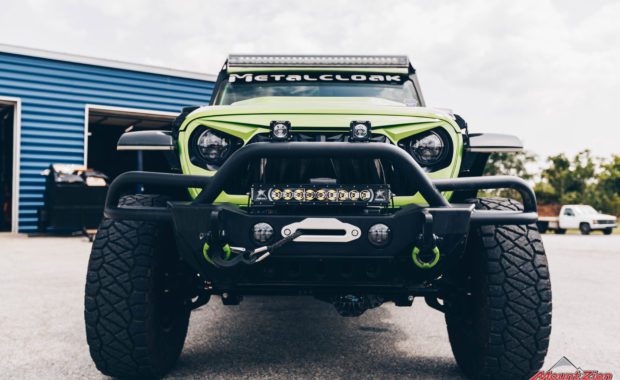 2020 Green Jeep Wrangler with 3.5 Metal Cloak lift kit with offroad bumper and offroad lighting front grille view