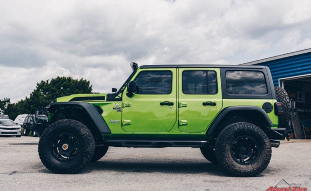 2020 Green Jeep Wrangler with 3.5 Metal Cloak lift kit on Teraflex Nomad Wheels 17x8.5 Deluxe Metallic Black and Nitto Ridge Grappler 37x12.50R17 Tires driver side view