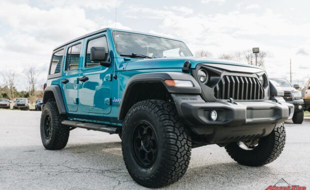 teal Jeep Wrangler with 2.5