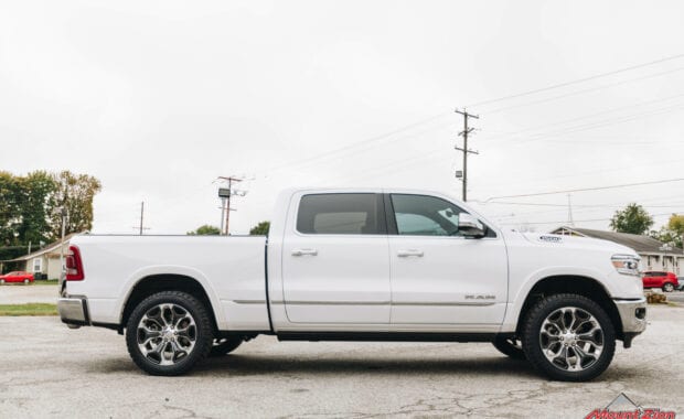 White Ram 1500 with Rough Country 2IN lift on LT285/50R22/10 121/118R NITTO TERRA GRAPPLER G2 tires passenger side view